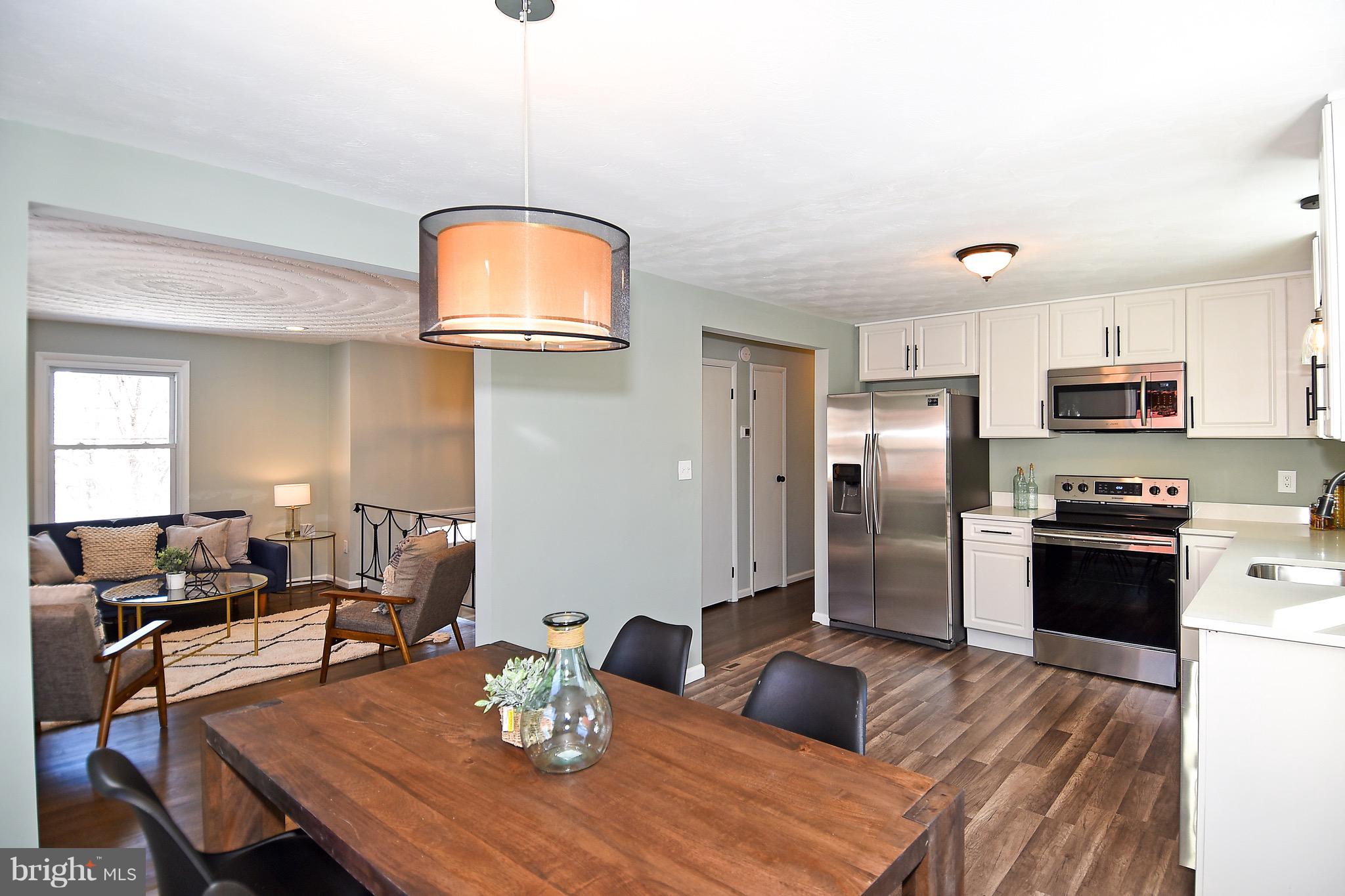 6404 Cipriano Road Lanham, MD 20706 - Photo 15 of 28 Dining, Kitchen, Living - Open
