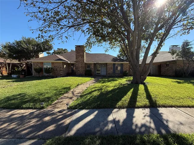 a view of yard with large trees and a yard