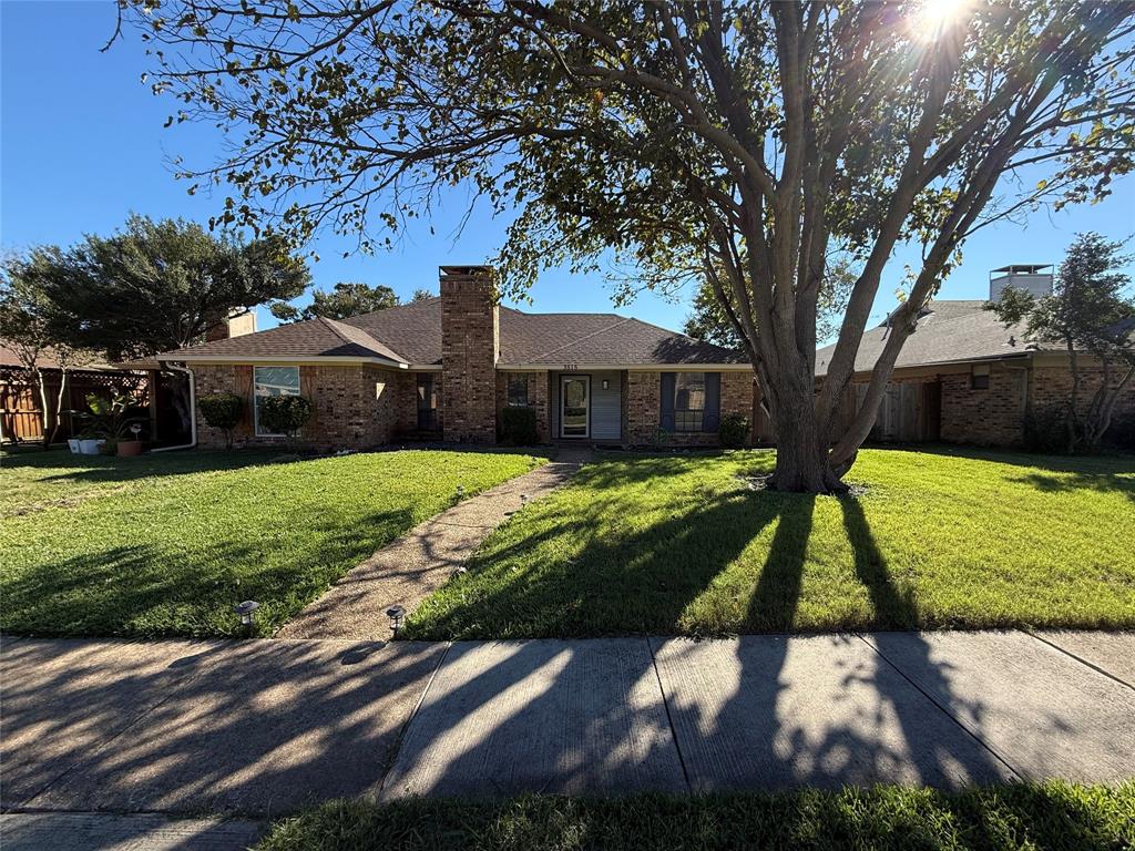 3515 Hilltop Lane Plano, TX 75023 - Photo 1 of 19 a view of yard with large trees and a yard