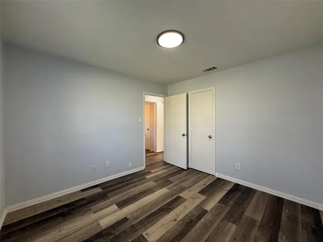 a view of room with window and ceiling fan