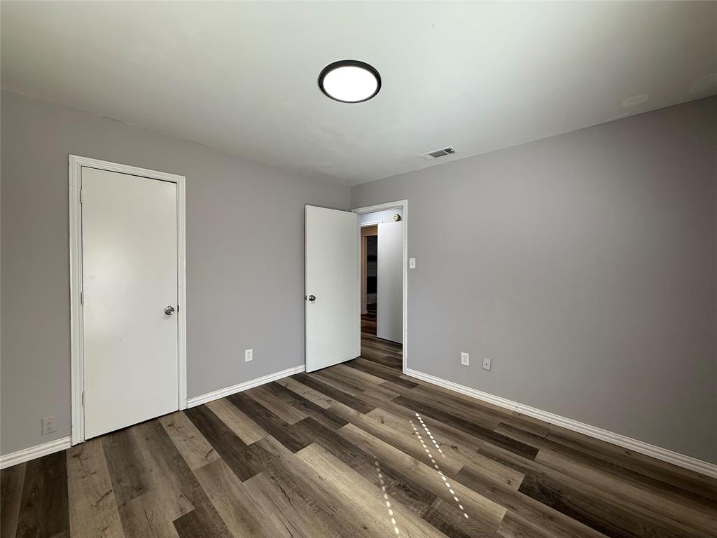 3515 Hilltop Lane Plano, TX 75023 - Photo 15 of 19 a view of a room with wooden floor and window