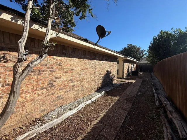 a view of a backyard of the house