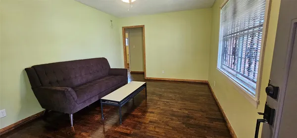 a living room with furniture and a rug