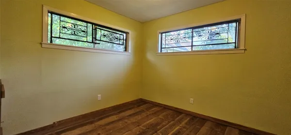 a view of a small space with window and wall painting