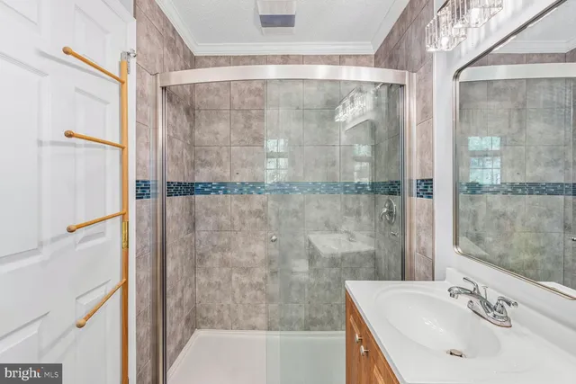 a bathroom with a sink and shower