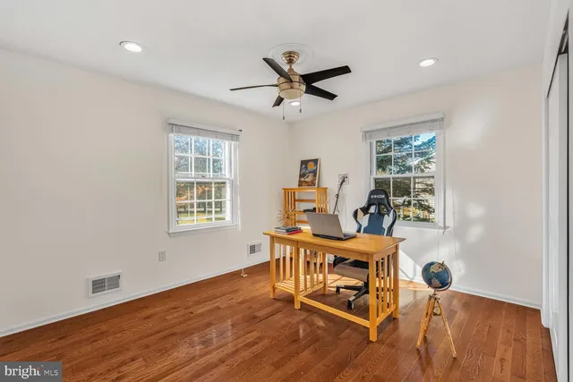 a work room with furniture and windows