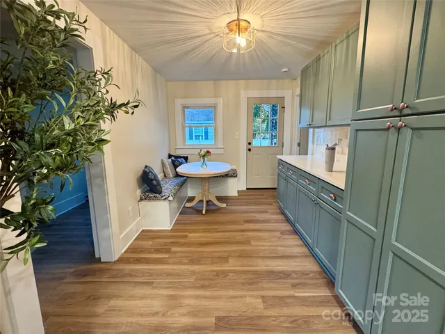 a room with wooden floor and furniture