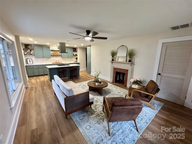 a living room with furniture and a fireplace