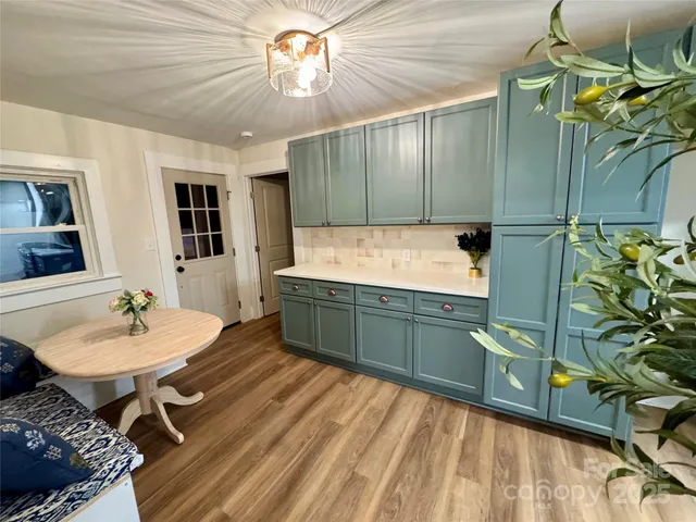 a kitchen with a sink and cabinets