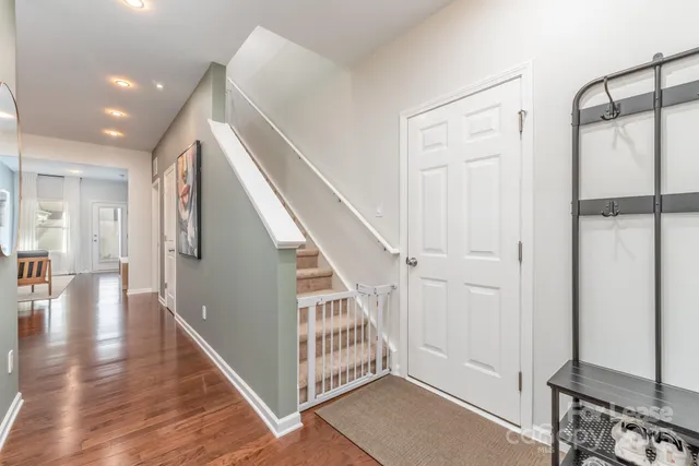 a view of an entryway with wooden floor and windows