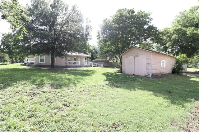 a view of a backyard with a garden