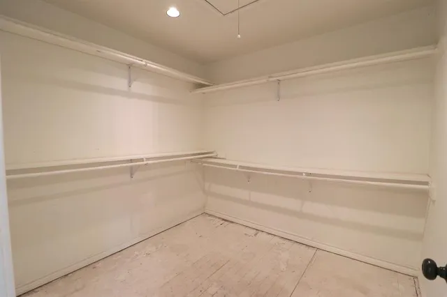 a view of an empty walk in closet