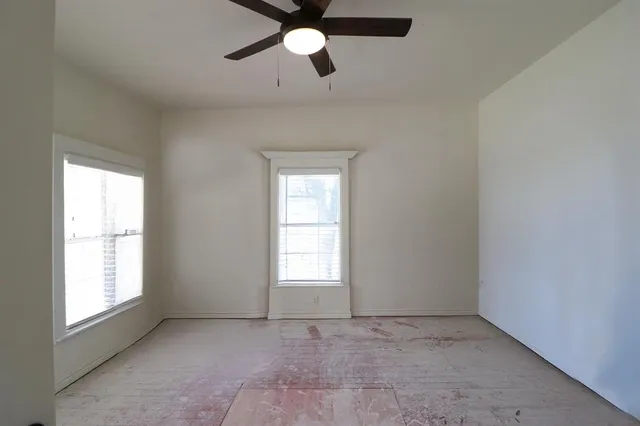 a view of empty room with windows