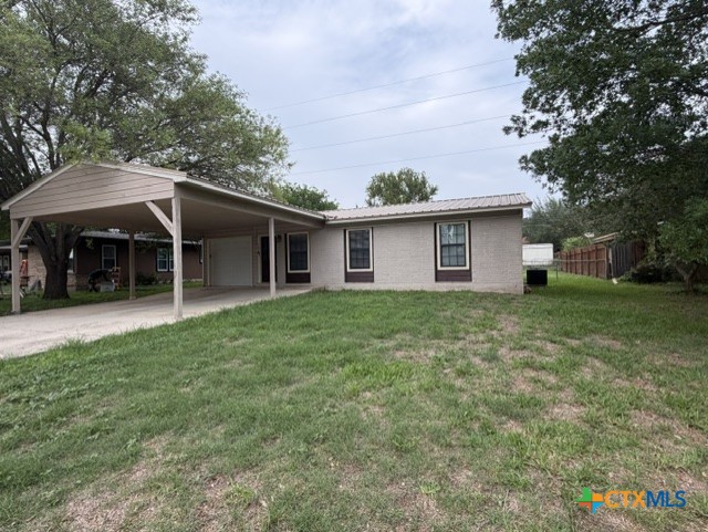 127 Hillcrest Drive Luling, TX 78648 - Photo 24 of 26 a front view of house with yard and trees around