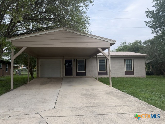 127 Hillcrest Drive Luling, TX 78648 - Photo 25 of 26 a front view of house with yard and green space
