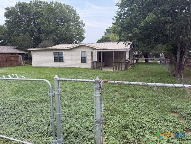 127 Hillcrest Drive Luling, TX 78648 - Photo 26 of 26 a view of a yard in front of a house with a large tree