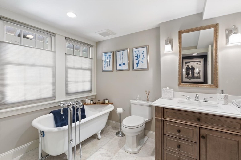 77 Main Street Boxford, MA 01921 - Photo 11 of 32 a bathroom with a sink a toilet and a mirror