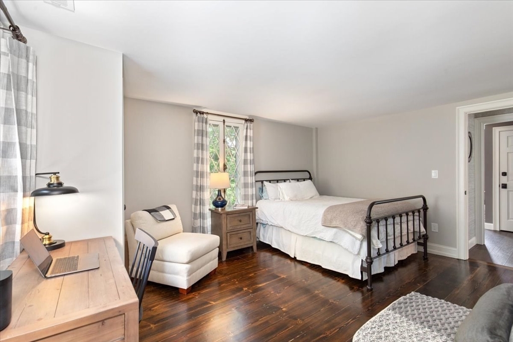 77 Main Street Boxford, MA 01921 - Photo 13 of 32 a bedroom with a bed and wooden floor