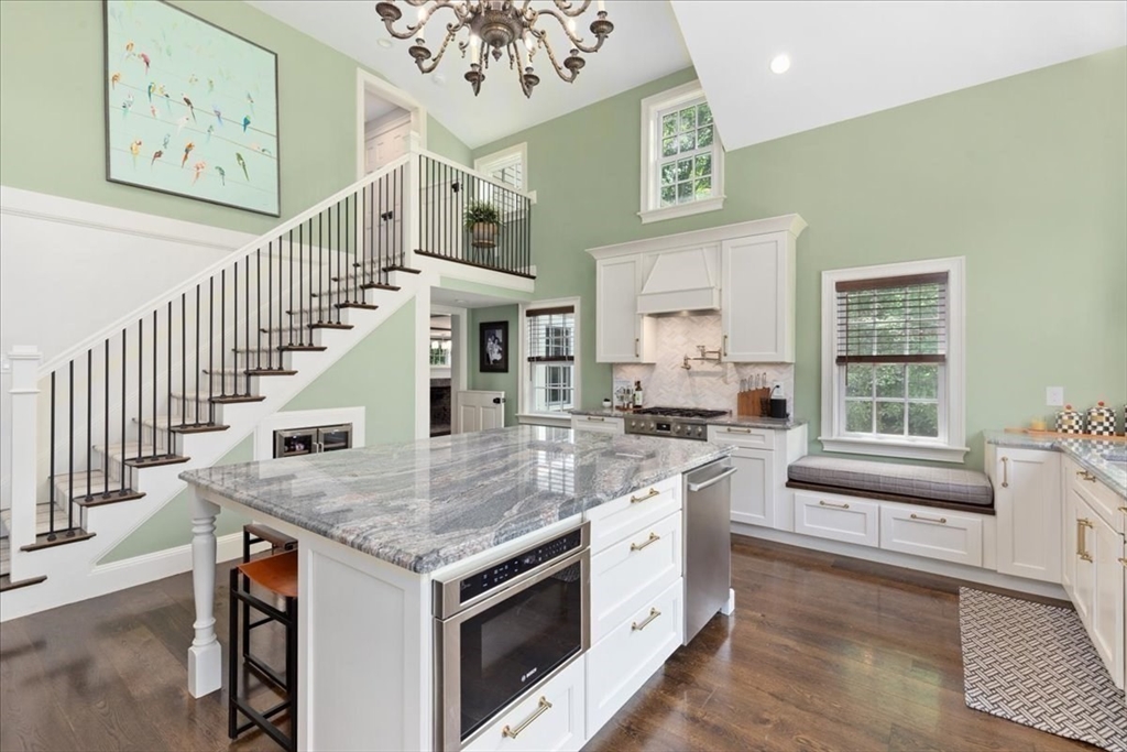 77 Main Street Boxford, MA 01921 - Photo 17 of 32 a kitchen with stainless steel appliances granite countertop a stove and cabinets