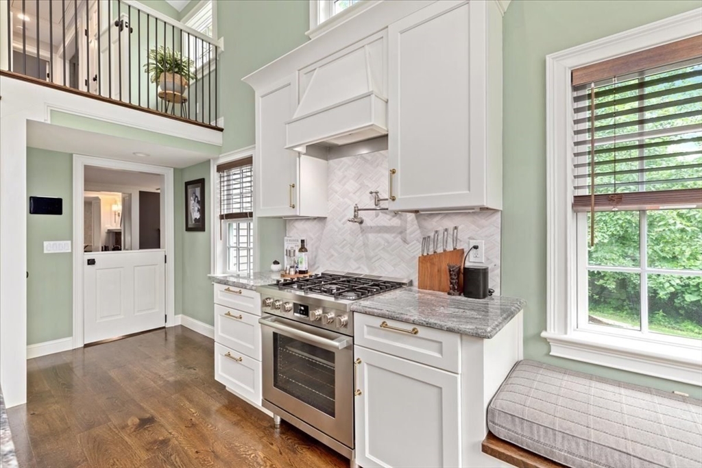 77 Main Street Boxford, MA 01921 - Photo 18 of 32 a kitchen with stainless steel appliances granite countertop a stove and a white cabinets