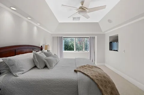 a bed room with a bed and a window