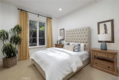 an aerial view of a house with a yard and outdoor seating