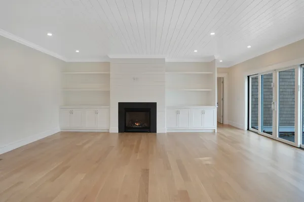 a view of an entryway with wooden floor