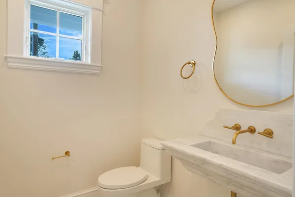 a bathroom with double sink and a mirror