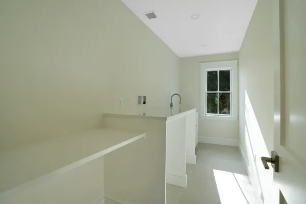 a view of a kitchen with an empty room