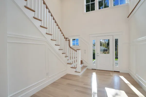a large kitchen with granite countertop a large counter top stainless steel appliances and cabinets