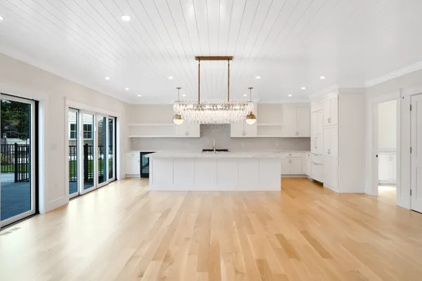 a kitchen with stove and cabinets