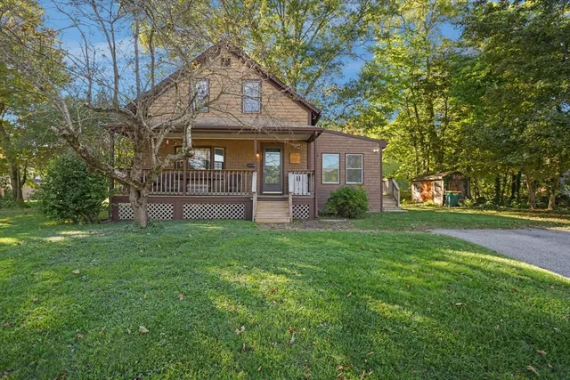 a view of a house with a yard