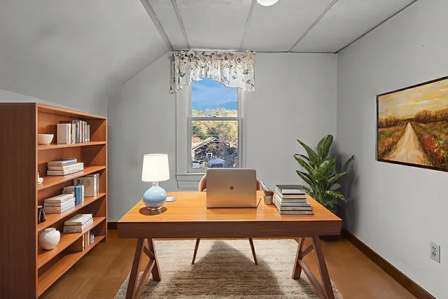 a view of a workspace with furniture