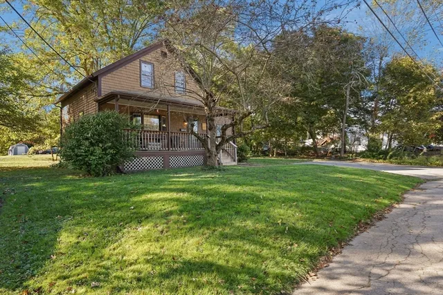 a front view of a house with a yard