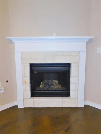 a view of kitchen with kitchen island stainless steel appliances refrigerator stove microwave and cabinets