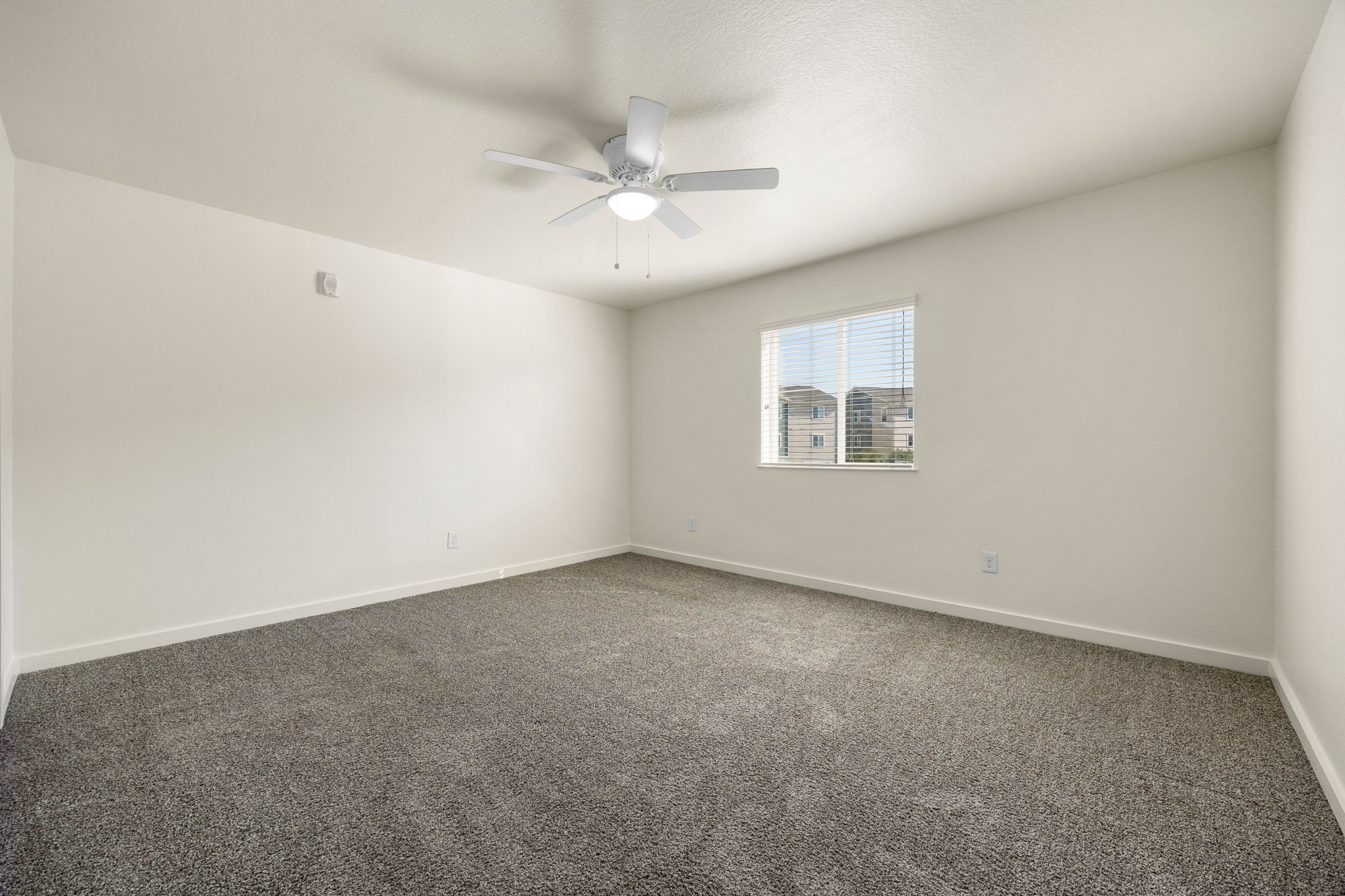 21155 Gosling Road, Unit 30 Spring, TX 77388 - Photo 17 of 32 an empty room with a window and a fan