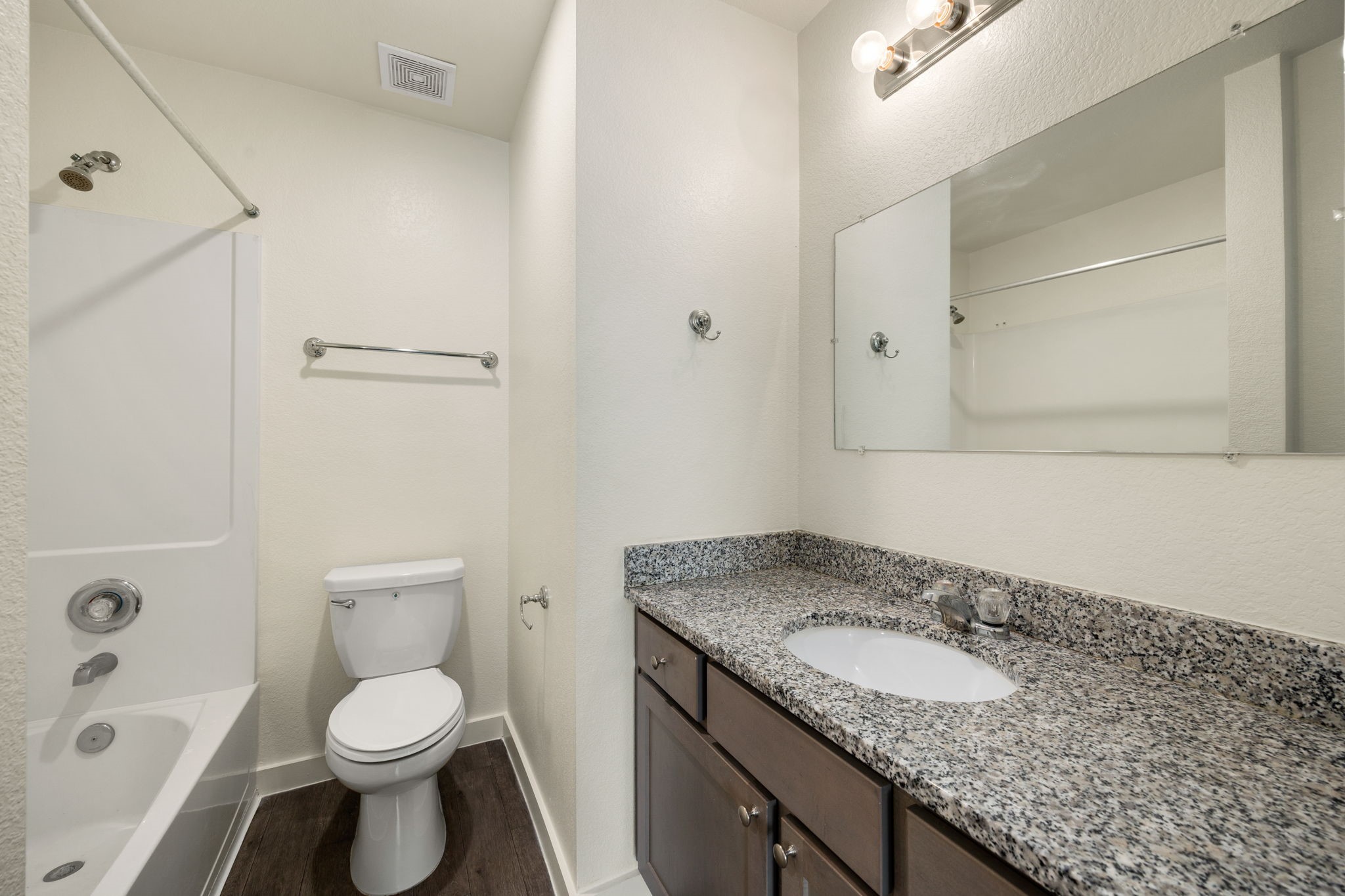 21155 Gosling Road, Unit 30 Spring, TX 77388 - Photo 18 of 32 a bathroom with a granite countertop sink toilet and shower