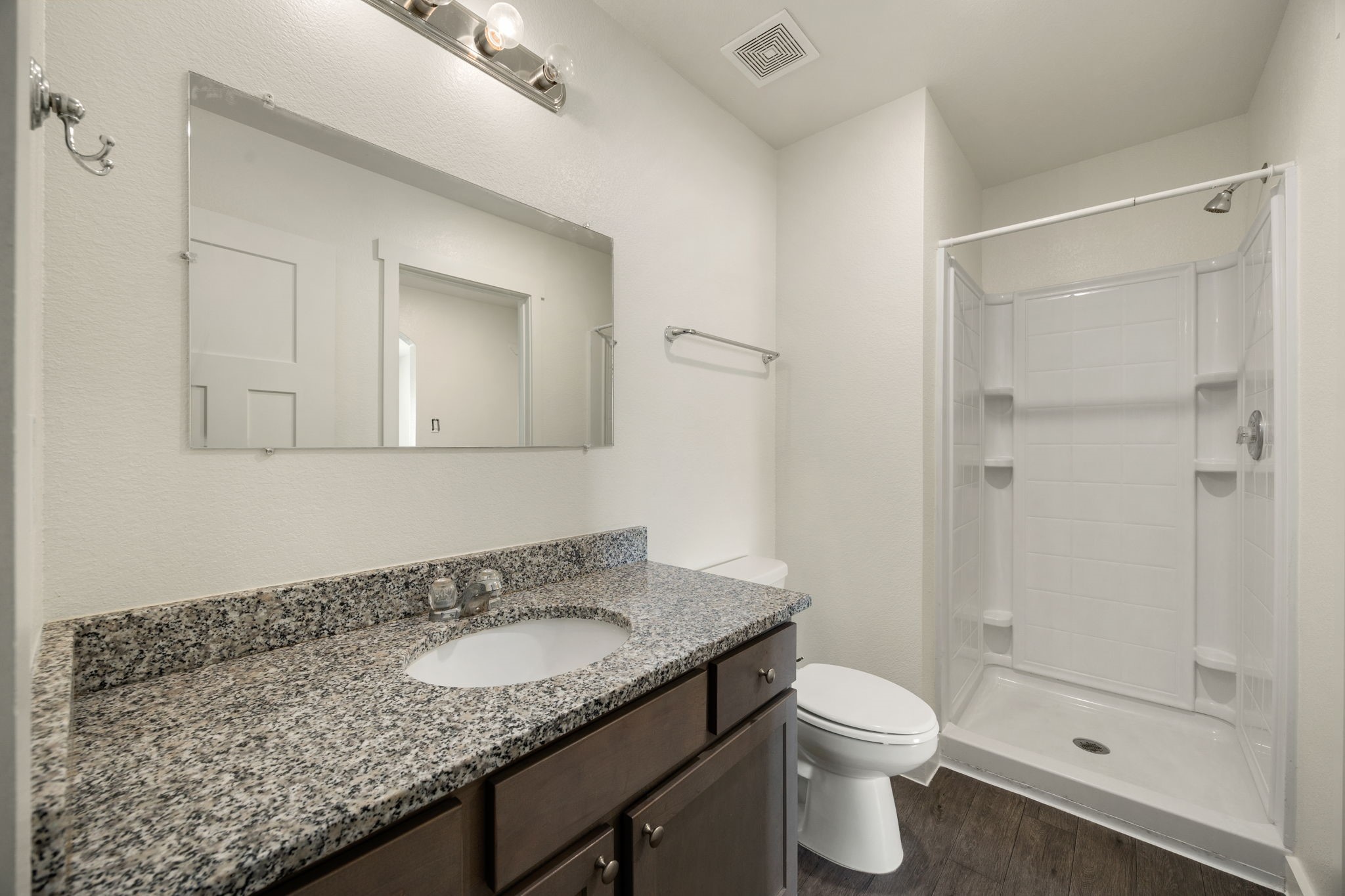 21155 Gosling Road, Unit 30 Spring, TX 77388 - Photo 24 of 32 a bathroom with a granite countertop sink toilet and shower