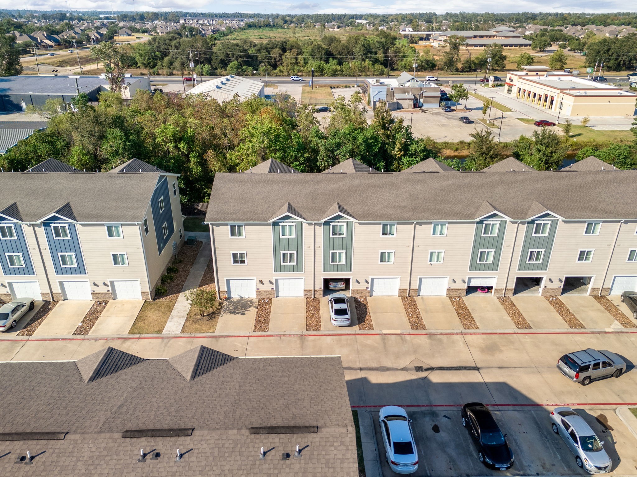 21155 Gosling Road, Unit 30 Spring, TX 77388 - Photo 30 of 32 an aerial view of residential houses with outdoor space and parking
