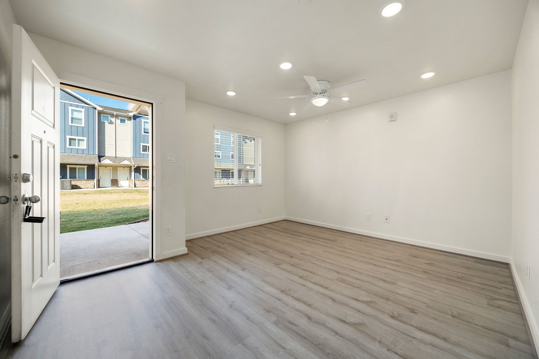 21155 Gosling Road, Unit 30 Spring, TX 77388 - Photo 3 of 32 an empty room with wooden floor and windows