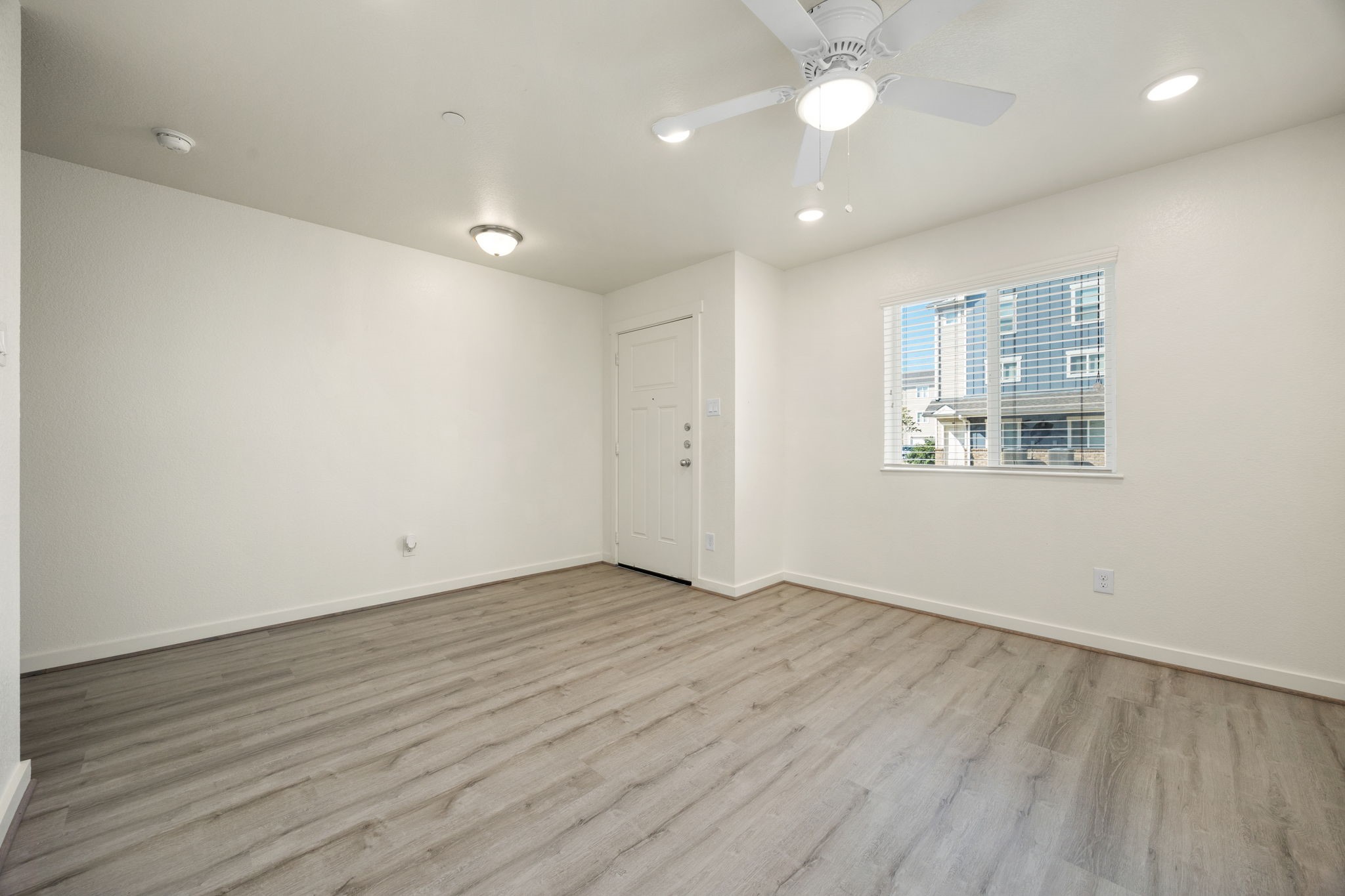21155 Gosling Road, Unit 30 Spring, TX 77388 - Photo 7 of 32 an empty room with wooden floor and windows