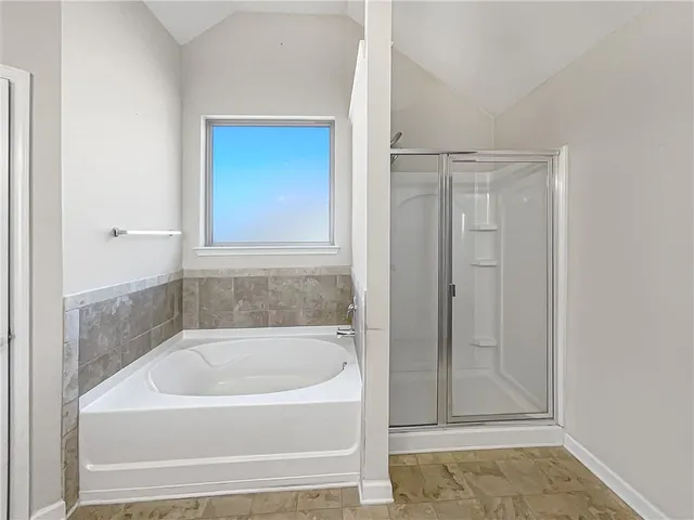 a white bath tub sitting in a bathroom