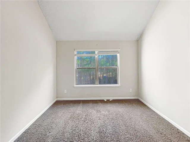 a view of a living room with furniture