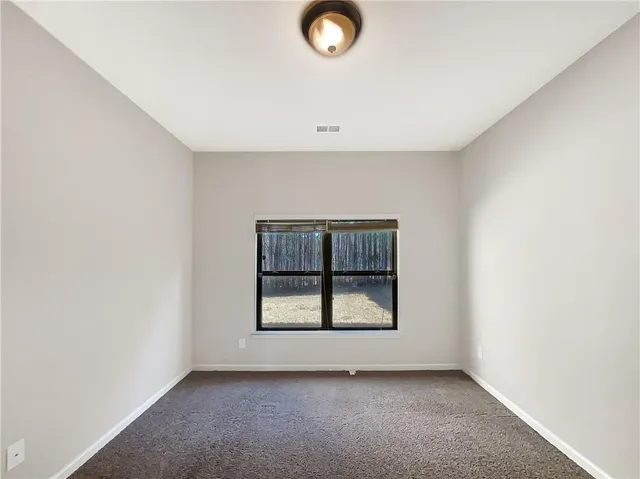 a view of backyard with pathway