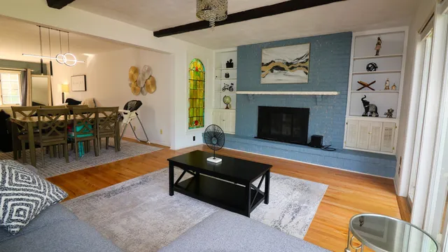 a living room with furniture and a fireplace