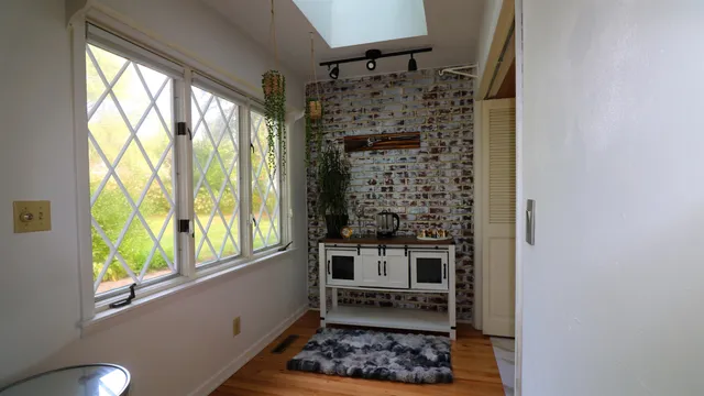 a bathroom with a bathtub and a window