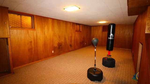 a view of gym equipment and wooden floor