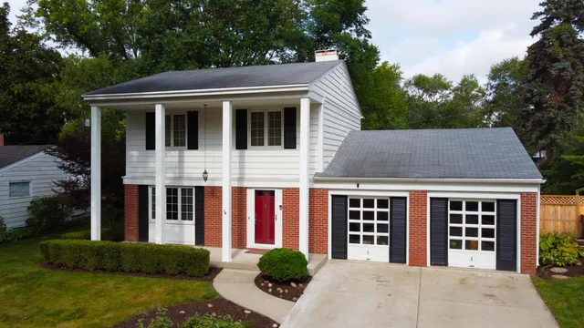 a view of a house with garden and yard