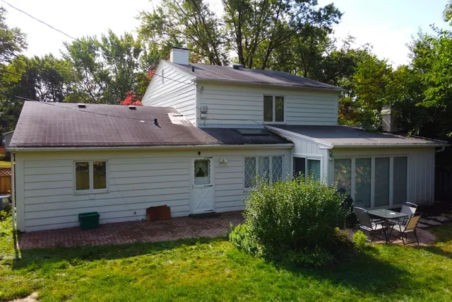 a view of a house with a yard and plants
