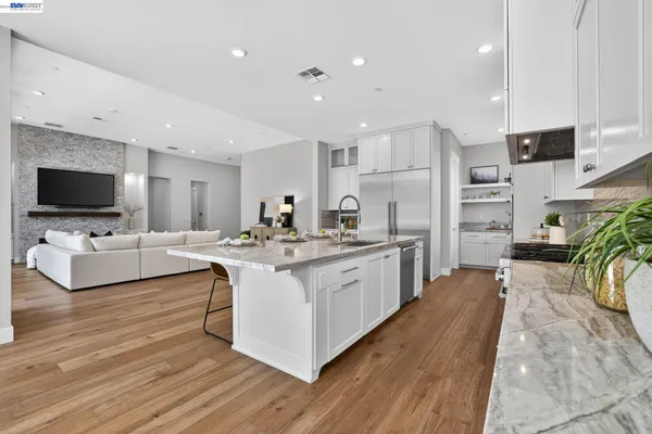 a dining room with furniture wooden floor and a rug